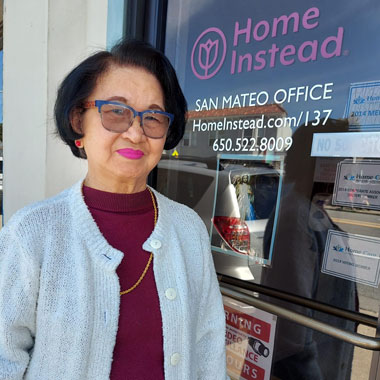 Home Instead San Mateo Office Employee by the front door