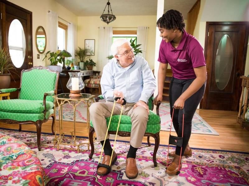 home instead caregiver assists senior client transition to home care