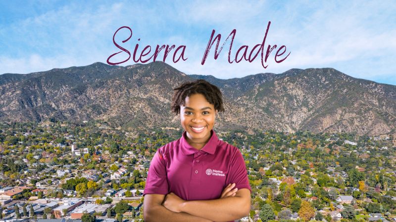 Home Instead caregiver with Sierra Madre, CA in the background