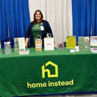 home instead booth at the job fair