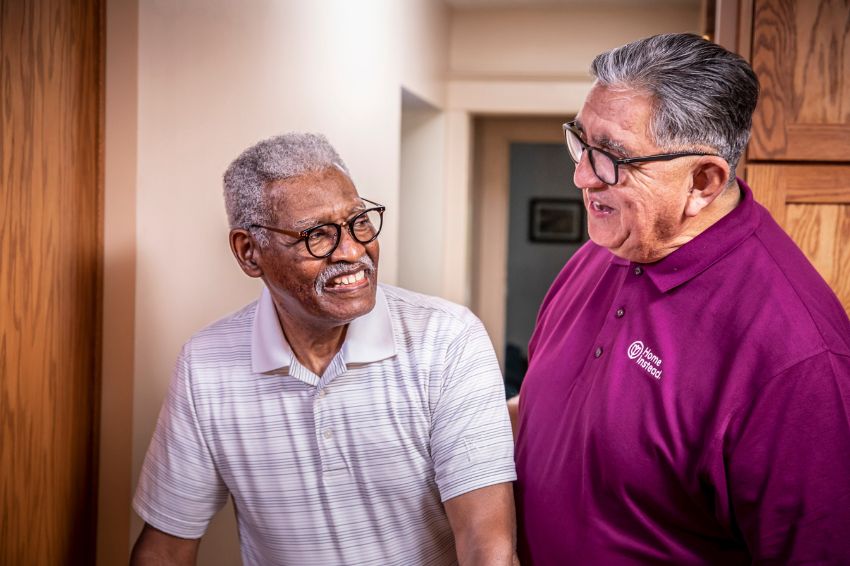 Home Instead Caregiver and senior enjoying each other sharing a laugh